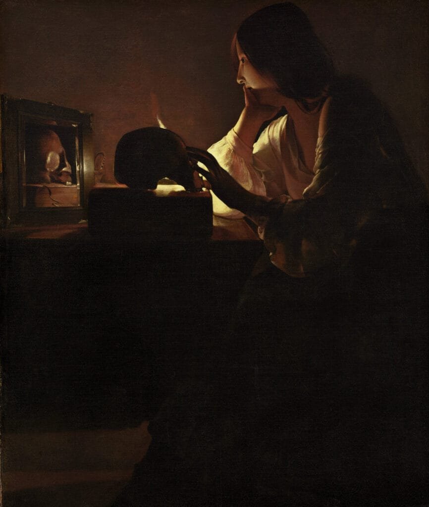 Tableau de Georges de La Tour, "La Madeleine au miroir". On y voit Marie-Madeleine tenant un crâne où brûle une bougie, elle se tient assise devant le miroir, pensive.